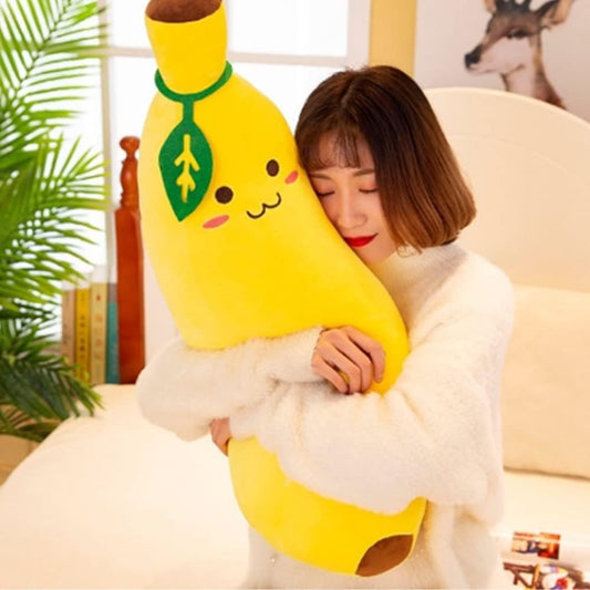 Girl hugging a Banana Plush Pillow, super soft cuddly toy for kids and adults, perfect for napping and fun design.